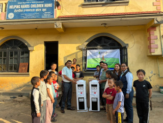 कामना सेवा विकास बैकद्धारा हेल्पिङ ह्यान्डस बाल गृहलाई वाटर डिस्पेन्सर हस्तान्तरण